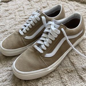 Brand new khaki vans never worn still have the vans sticker on the bottom.